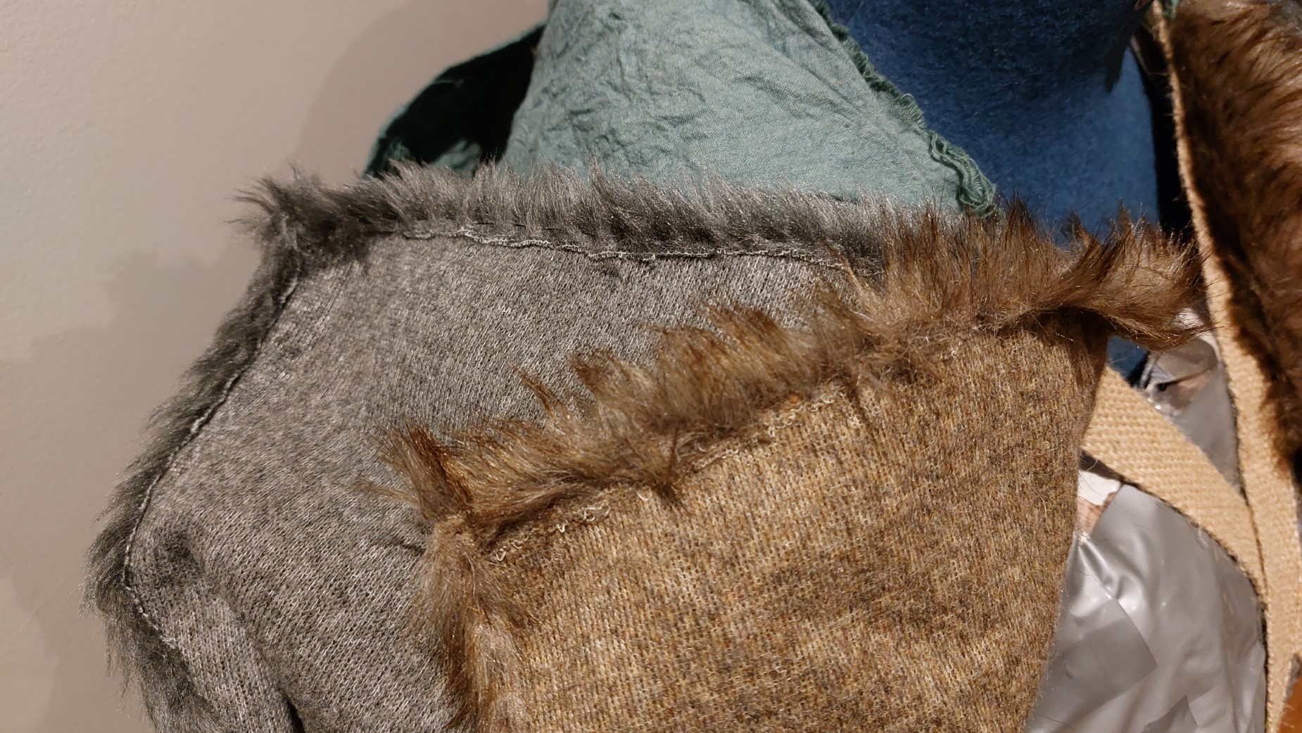 Hand sewing the fur